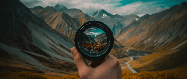 A person holding a camera to photograph a mountain peak generated by AI.